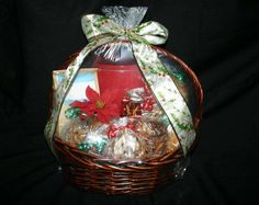 a basket filled with cookies and candies on top of a black tableclothed background