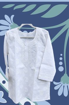 This gorgeous white tunic, hand embroidered Indian ethnic short top is a must-have for your wardrobe! Crafted from 100% soft artisan cotton, you'll love the luxuriously comfortable feel of this piece. The classic style, with its clean lines and subtle detailing, makes it perfect to wear dressed up or down - it's versatile enough to go from day to night in an instant. Such an essential piece for your capsule wardrobe. Available in plus size kurti to small size kurti. This unique and eye-catching piece is handmade with quality materials and features either sleeveless or long sleeve options, allowing you to customize it to your personal style. Whether you are looking to find the perfect gift or beach wear, or you're simply looking to bring a little extra mindfulness and serenity to your day t Kurti Straight, Indian Kurti, Short Tunic, Short Kurta, Short Kurti, Cotton Kurti, White Tunic, Beautiful Blouses, Beach Wears