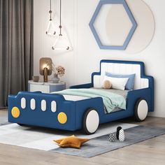 a child's bedroom with a blue car bed and white rugs on the floor