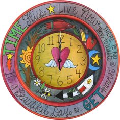 a colorful clock with words written on it and an image of a heart in the center