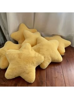 four yellow stars are laying on the floor