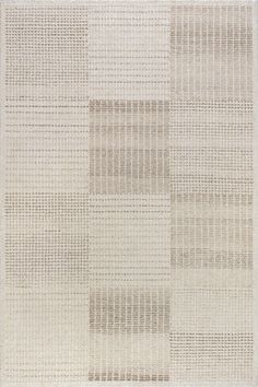 an area rug with squares and lines on the ground, in neutral colors that appear to be woven or wovened together