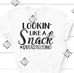 Breastfeeding Moms Stay Looking Like A Snack. This Lookin Like A Snack #Breastfeeding Tee Is The Perfect Tee For You. Available In Most Sizes, Vneck Or Crew Neck, White, Short Or Long Sleeve (Additional $7). Specify When Ordering Or We Will Choose For You. Ask About Other Colors Availability When Ordering. Made When Ordered. Get Yours Today!! Breastfeeding Shirts, Looking Like A Snack, Breastfeeding Shirt, White Short, Bella Canvas, Womens Tops, Tops & Tees, Snacks, Crew Neck