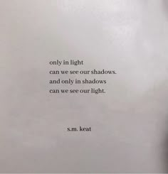 a hand holding a piece of paper with a quote on it that reads, only in light can we see our shadows and only in shadows can we see our light