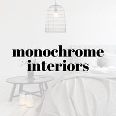 the words monochrome interiors are in black and white letters over a bed