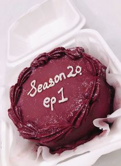 a red frosted cake with the words season 29 on it