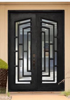 a black double door with glass panels