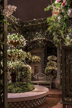 the inside of a building with lots of flowers