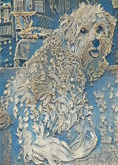 a white dog sitting on top of a blue couch in front of a wall covered in lace