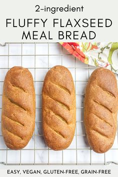 three loafs of fluffy flaxseed meal bread on a cooling rack with text overlay