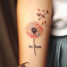 a woman's arm with a dandelion tattoo that says, let them