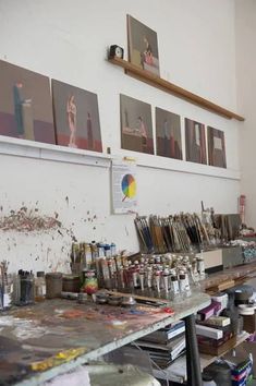 an artist's studio with lots of art supplies