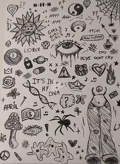 a drawing with many different things drawn on the paper, including an image of a spiderman and other symbols