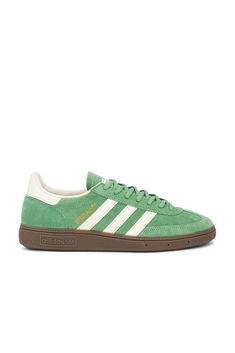 Suede upper with rubber gum sole.  Made in Vietnam.  Lace-up front.  adidas Handball Spezial logo patch at tongue.  Signature three leather stripes at side panels.  Lightly padded low-cut collar with leather lining.  .  .  .  .  .  .  .  .  .  . Adidas Handball Spezial, Adidas Handball, Green Cream, White Crystal, Adidas Samba, Cream White, Panel Siding, Low Cut, Patch Logo