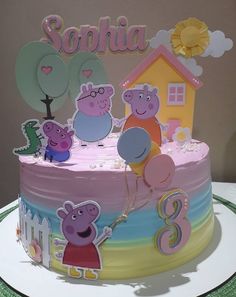 a birthday cake with peppa the pig and friends on it's top tier