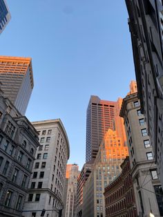 looking up at tall buildings in the city