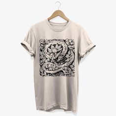 Elegant Japanese dragon mythical creature surrounded by lotus flowers, hand drawn graphic design. Do you prefer a different print color or t-shirt color? No problem, send me a message with your request so I can confirm and print it as YOU like. Do you want one of the prints on hoodies, kid sizes or a specific garment? Just contact me and I will contact you back as soon as possible. UNISEX T-SHIRT info: This t-shirt compliments any outfit. It's made of a heavier cotton and the double-stitched nec Japanese Dragon, Mythical Creature, Lotus Flowers, Japanese Aesthetic, Japan Art, Art T Shirt, No Problem, Lotus Flower, Mythical Creatures