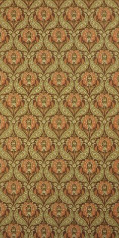 an orange, green and brown pattern on fabric