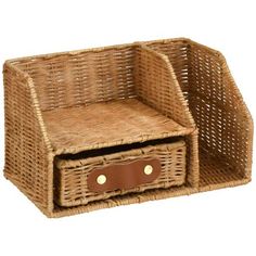 a wicker basket with two drawers and leather handles