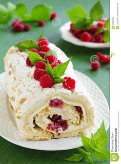 a wrap with raspberries is on a plate