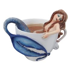 there is a cup with a mermaid in it