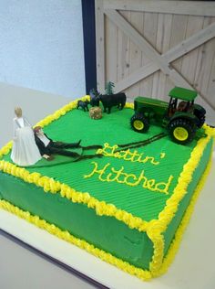 a cake that is decorated with green and yellow frosting