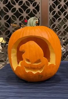 a carved pumpkin sitting on top of a table