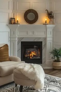 a living room filled with furniture and a fire place in the middle of the room