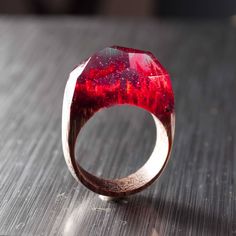 "Resin Ring made of exotic wood and epoxy resin. Perfect gift for women. I pick over the best materials while manufacturing rings. Natural high-quality wood out of noble tree species encloses a piece of nature, spirit and energy of a place it was growing at. Resin used is characterized by high clarity, hardness and also great light refraction index. It is hypoallergic, ecological, so it doesn't cause any skin reaction. After shaping up and polishing resin acquires gloss and sparkle and isn't bei Red Resin Rings As A Gift, Red Resin Ring Suitable For Gifts, Gift Red Resin Rings, Red Resin Rings Suitable For Gifts, Polishing Resin, Ring Resin, Resin Rings, Red Ring, Red Rings