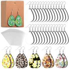 twelve pairs of earrings with different designs and colors on each earring, including leopard print