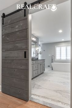 an open door leading to a large bathroom