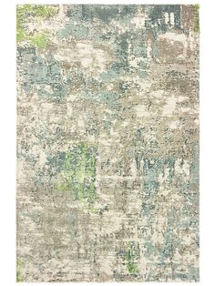 an area rug with various colors and patterns on it, including blue, green, beige, and white