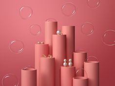 an abstract pink background with soap bubbles and pearls on the end of each tube,