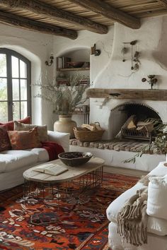 a living room filled with furniture and a fire place in the middle of a room