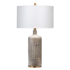 a table lamp with a white shade on it