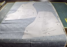 the fabric is laid out on the table to be sewn