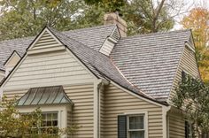 a house with a metal roof in the fall