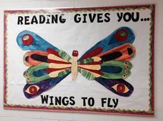 a sign that says reading gives you wings to fly on the side of a wall