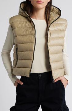 Whether you're deep in the backcountry or just your own backyard, you'll appreciate the cozy core warmth and weather-shedding dryness of this vest filled with lofty synthetic-down insulation. 20" length (size 3) Two-way front-zip closure Fixed hood Front zip pockets Wind resistant Lined, with 100% polyester fill 100% nylon Machine wash, line dry Made in China Cozy Core, Hooded Puffer Vest, Save The Duck, Outerwear Vest, The Duck, Puffer Vest, Outerwear Women, Repellent, Water Repellent