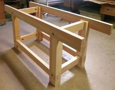 a wooden bench being built in a shop