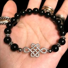 Onyx Gemstone Cz Celtic Knot Bracelet / Bead / Beaded Bracelet / Fits 6 To 7.5 Inch Wrist ( If You Need A Different Size Just Lmk ) Handmade By Me Genuine 8mm Black Onyx Gemstones Beads . White Gold Plated With Micro Pave Cubic Zirconia Celtic Knot Charm. I Ship Fast! Any Questions Lmk ! Tags : Celt / Norse / Nordic / Irish / St Patrick’s Day / Natural Stones / Gem / Gems / Healing Stones & Crystals / Handcrafted / Boho / Bohemian / Boho Chic / Gypsie / Hippie / Festival / Goth / Gothic / Viking / Medieval / Victorian / Rock & Roll / Rocker / Rock Chic / Biker / Gift / Witch / Stylish / Trendy / Fairy / Luxury / Casual / Every Day Jewelry / Night Out / Clubbing / Fancy / Shi Gothic Viking, Viking Medieval, Celtic Knot Bracelet, Biker Gifts, Diamond Bling, Bracelet Bead, Knot Bracelet, Hippie Festival, Onyx Gemstone