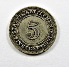 an old five cents coin with the number 5 on it