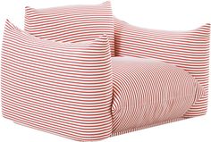 two red and white striped pillows sitting next to each other