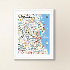 a framed map of massachusetts with the names and landmarks on it, against a white wall