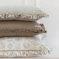 three pillows stacked on top of each other