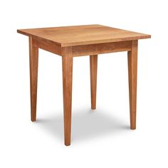 a small wooden table with one leg extended to the side and two legs at the top