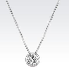 .50 carat, round diamond in 14 karat white gold bezel setting. The design hangs from an 20-inch box chain, also 14 karat white gold. Round Diamond Pendant, Dresses Hairstyles, Eco Chic, Dream Jewelry, Box Chain, Diamond Pendant