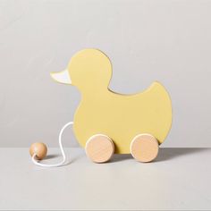 Pull-Along Painted Wooden Duck Toy Features Duck-Shaped Wood Cutout On Wooden Wheels Fabric And Wood Ball Handle For Pulling Along Floor Great Gift With A Charming Antique Look Suitable For Ages 18 Months And Up For A Cute And Classic Child's Toy, This Pull-Along Duck Toy From Hearth & Hand With Magnolia Makes A Perfect Pick. The Design Features A Duck-Shaped Wood Cutout Complete With Light Yellow Color And A Contrasting White Beak, And It's Perched On Natural-Finish Wooden Wheels That Spin And Move The Duck When The Attached Handle Is Pulled. A Wooden Knob On The White Fabric Cord Makes The Pull Handle Easy For Even Little Hands To Grip. Duck Nursery, Letter Candles, Hearth And Hand With Magnolia, Wood Baby Toys, Magnolia Colors, Pull Along Toys, Hearth & Hand With Magnolia, Yellow Nursery, Duck Toy