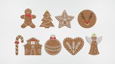 gingerbread cutouts are arranged on a white surface