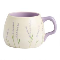 a purple and white mug with lavender flowers painted on it